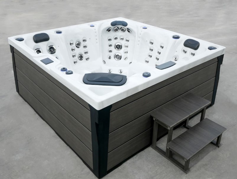 A Platinum Spas Onyx hot tub on concrete.
